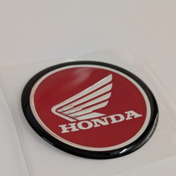 Logo cánh chim nhựa (cái bên trái) bình xăng lớn xe CL50, chính hãng Honda